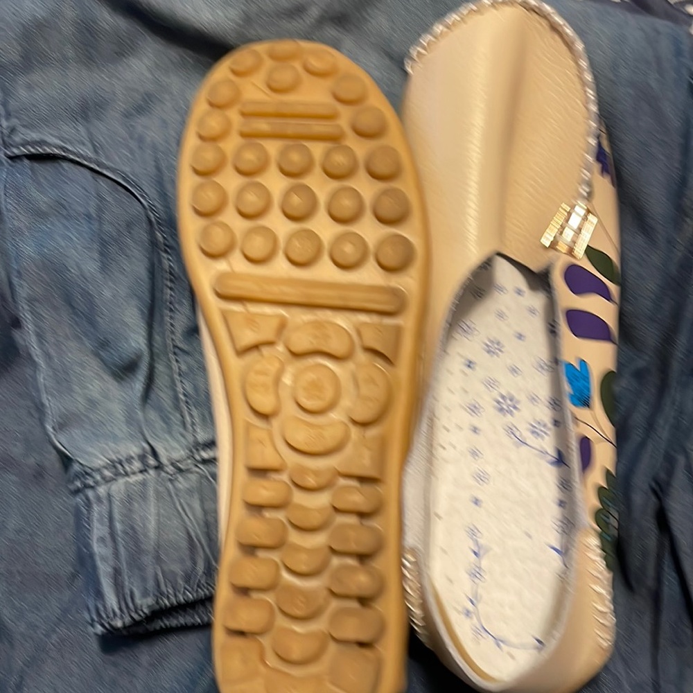Worn once cute flats with tv remote on the soles very unique size 8.5